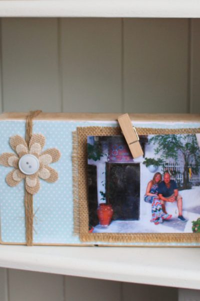 Who doesn't love photos to recall all those special moments and memories? We've got loads of them around the house, but also so many on our phones! To have a change from the traditional picture frame, I took a bit of scrapwood to create this unique DIY picture frame. And I'm thrilled with how it's turned out. It looks so cute in our bookcase. Check out how you can make your own budget, craft DIY picture frame with some basic materials! #picture #picture frame #frame #DIY #scrapwood