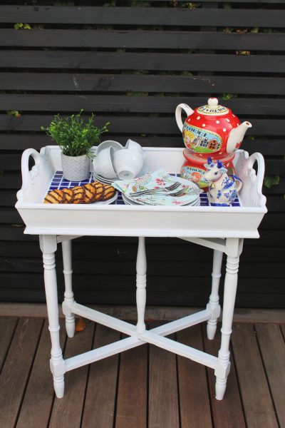 Butler Tray after makeover. White paint, blue mosaic tiles on summer patio