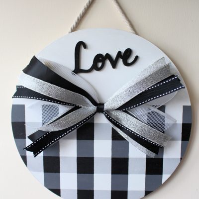 Old sign makeover with DIY buffalo plaid painting